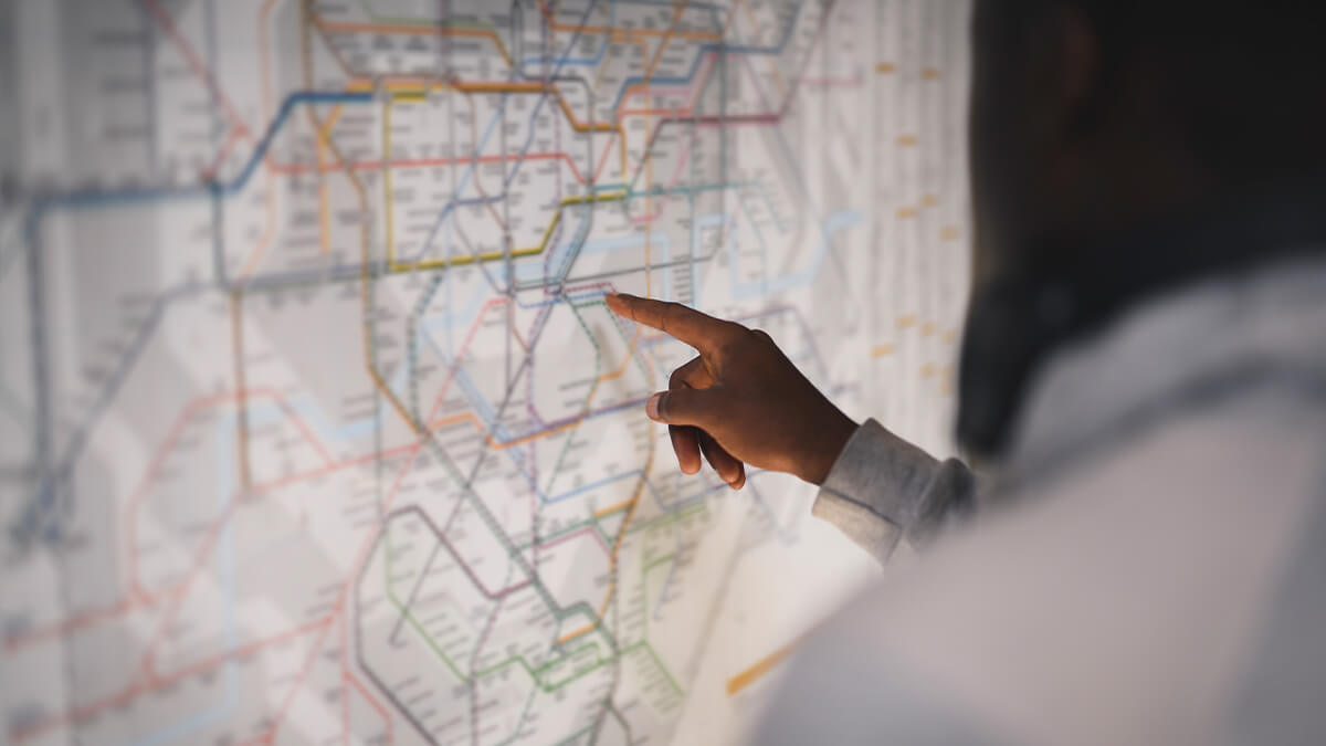 Employee pointing at an outage location on a digital map
